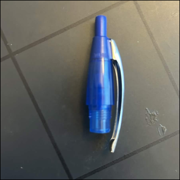 The button-section of a ballpoint pen, which due to the mechanism of the pen was needed in order to get the back-and-forth/locking system of the pen