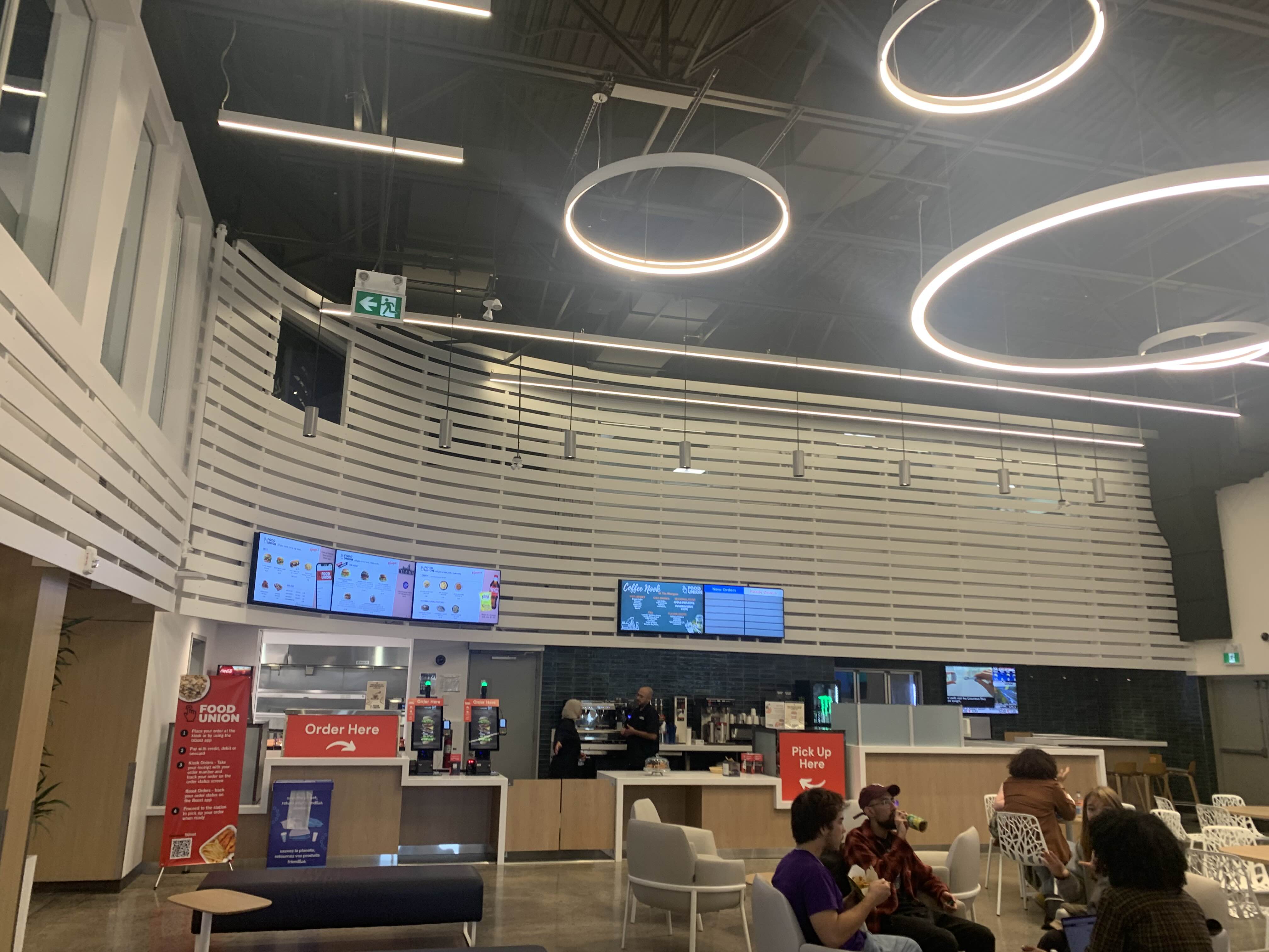 Other side of the marquee. We felt that the ordering kiosks were too close to the seating, and that the monitors were rather small compared to everything else present.